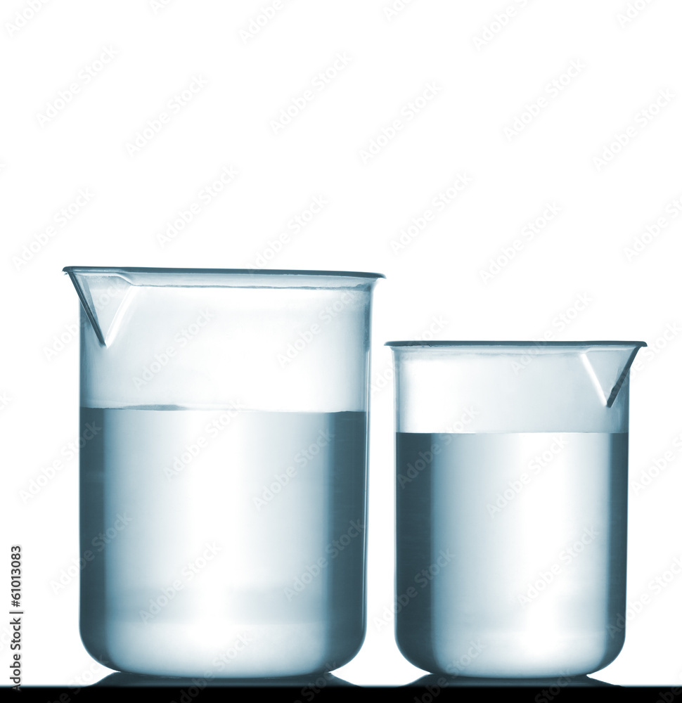 Isolated chemical plastic beakers on table with solution Isolated chemical plastic beakers on table with solution