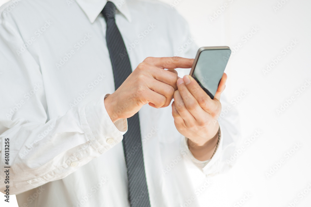 Close-up image of a man using a mobile smartphone Close-up image of a man using a mobile smartphone