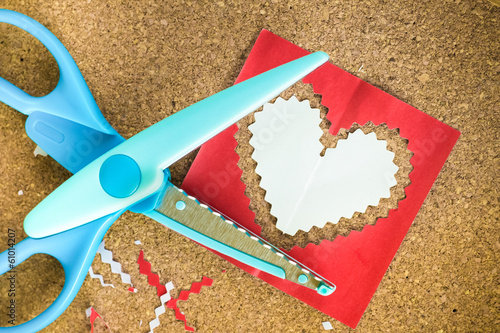 Cutting the heart shaped paper