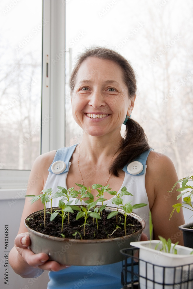 woman aged grows vegetables woman aged grows vegetables