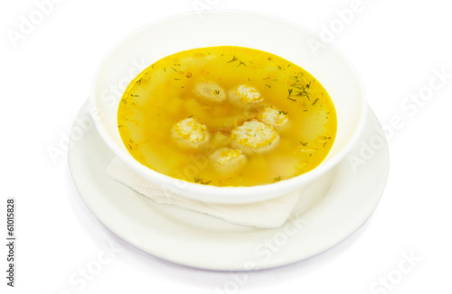 Soup with meatball and broth in plate, restaurant menu for child