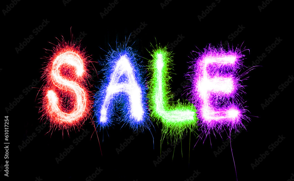 Sparkling inscription of SALE on a black Sparkling inscription of SALE on a black