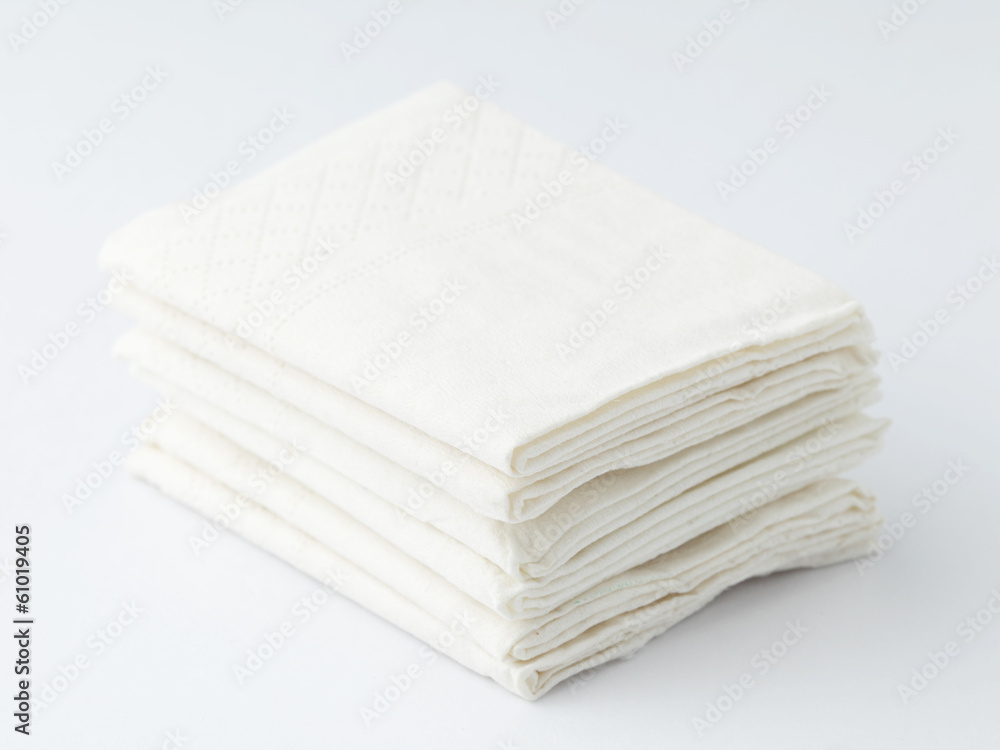 Stacks of folded disposable tissue Stacks of folded disposable tissue