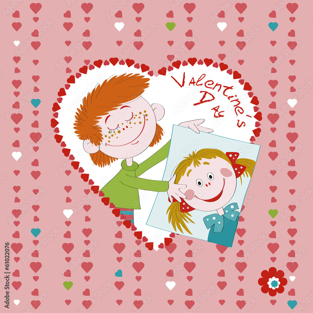 Valentine's Day. The enamoured boy holds a portrait of the girl. Valentine's Day. The enamoured boy holds a portrait of the girl.