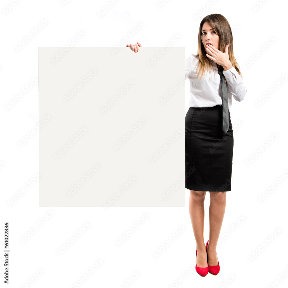 Businesswoman holding placard over white background Businesswoman holding placard over white background