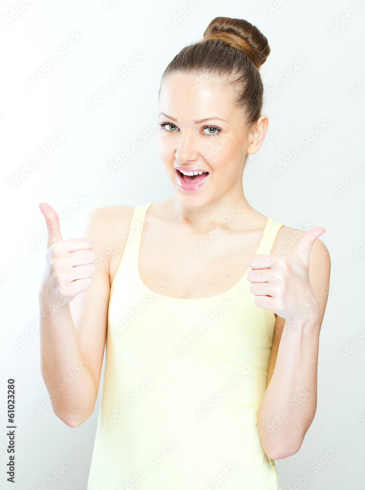 Pretty girl gives thumb up, isolated on white Pretty girl gives thumb up, isolated on white