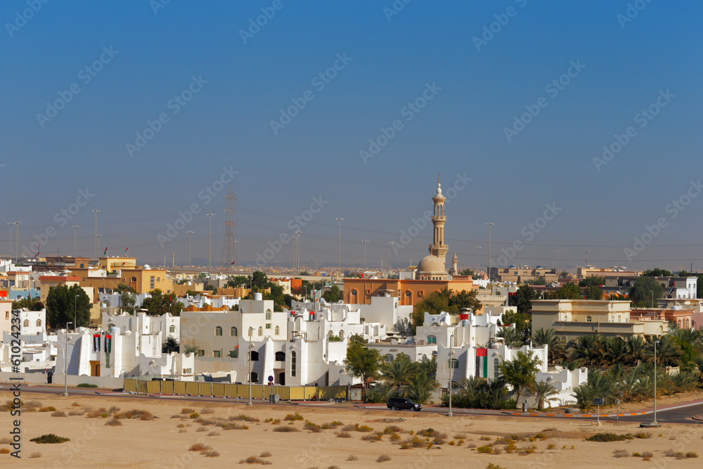 Suburban view of urban housing and local mosque in Abu Dhabi UAE