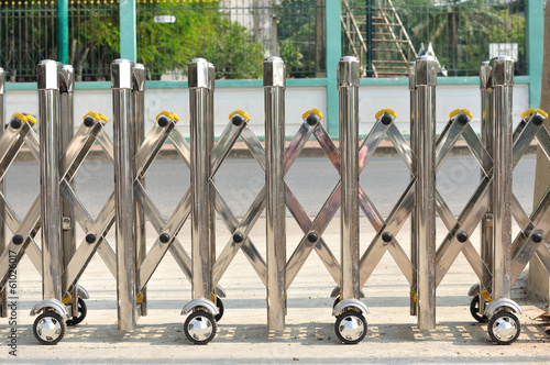 Iron sliding fence with wheel.