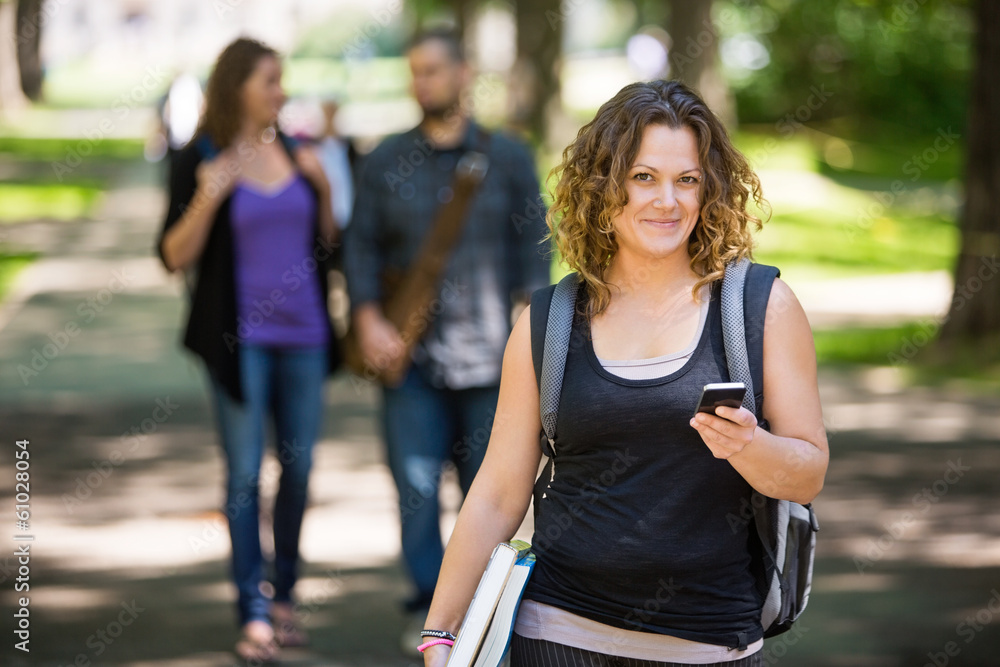 Female Student Using Cellphone On Campus Female Student Using Cellphone On Campus