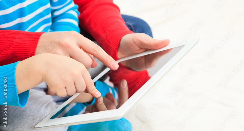 Family with touch pad at home