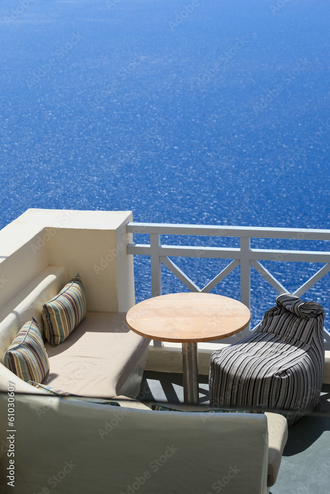 Fototapeta premium Scenic cafe tables on Santorini island, Greece