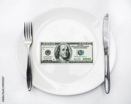 American US dollar in the white plate. photo