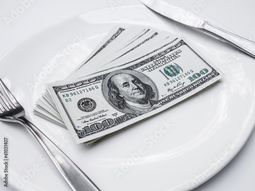 American US dollars in the white plate.