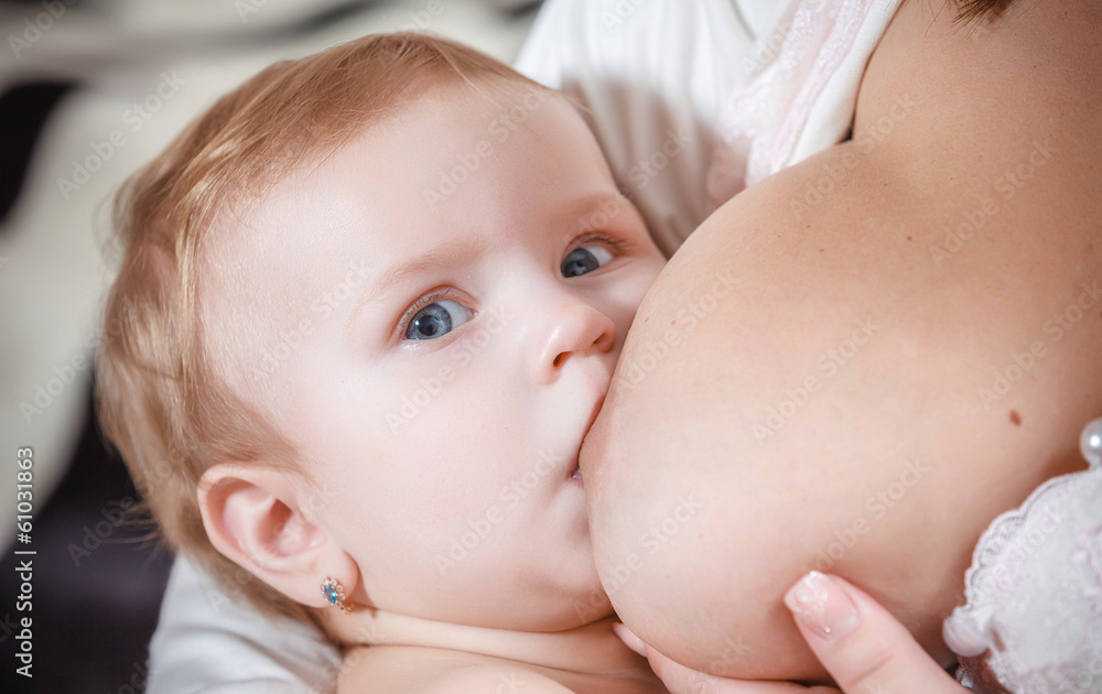 Mother breast feeding newborn baby Mother breast feeding newborn baby