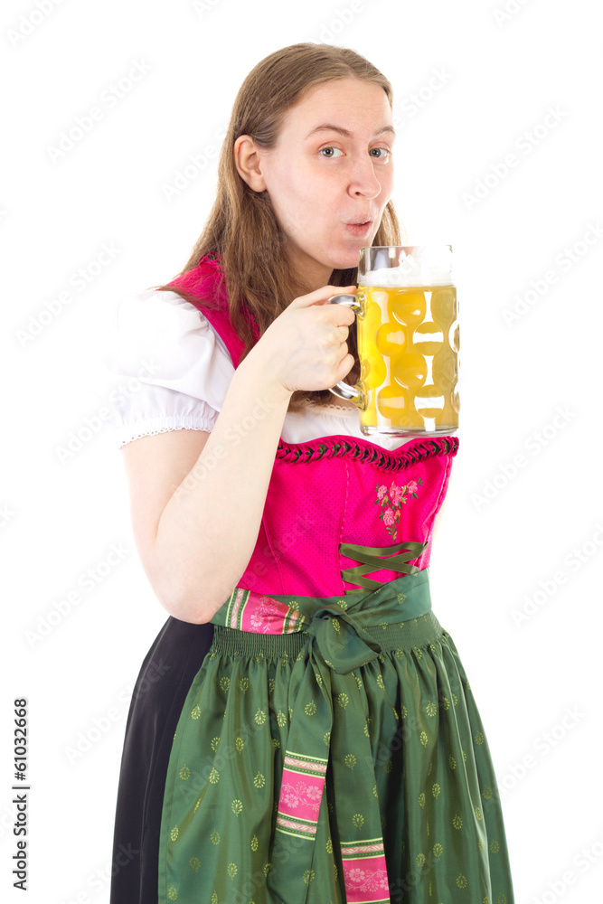 Woman in dirndl drinking delicious beer at oktoberfest Woman in dirndl drinking delicious beer at oktoberfest
