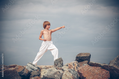 Young boy training karate