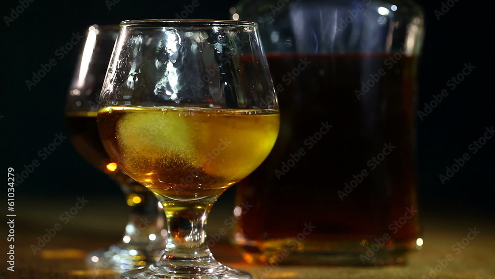 Cognac, brandy and ice. Alcohol close up Cognac, brandy and ice. Alcohol close up