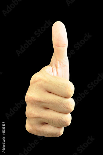Hand giving thumbs up isolated on black