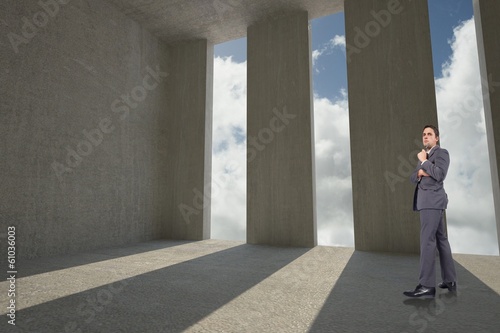 Composite image of thoughtful businessman holding pen to chin © WavebreakMediaMicro