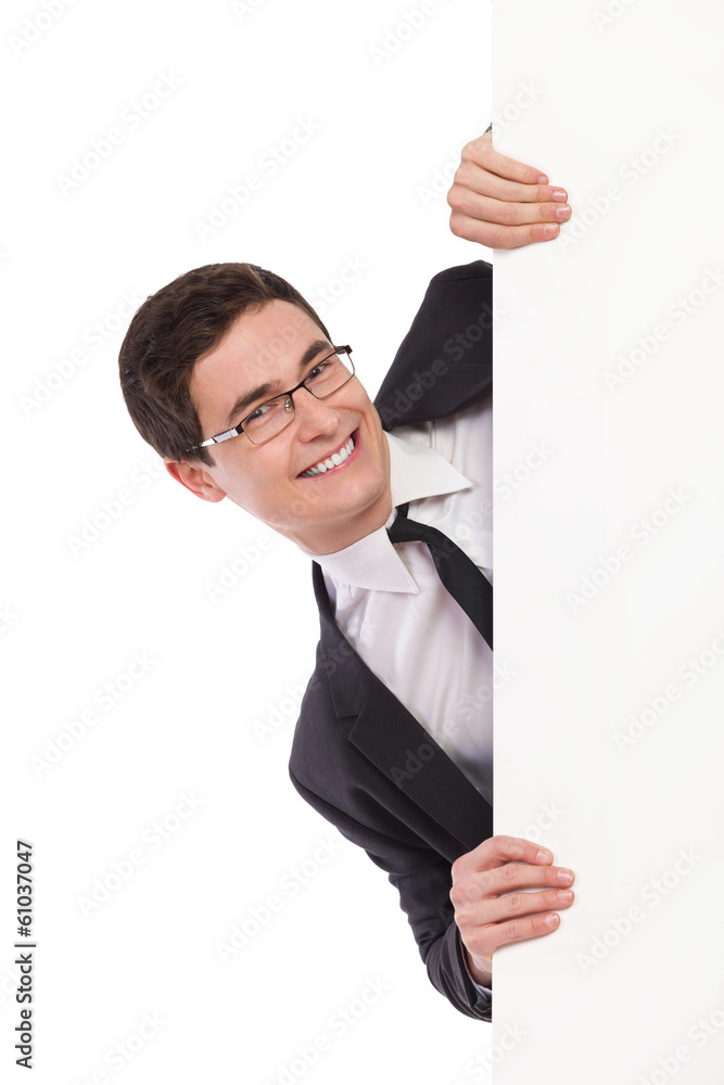 Happy student peeking behind a banner. Happy student peeking behind a banner.