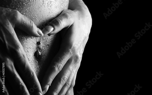 Woman's hands on wet skin photo