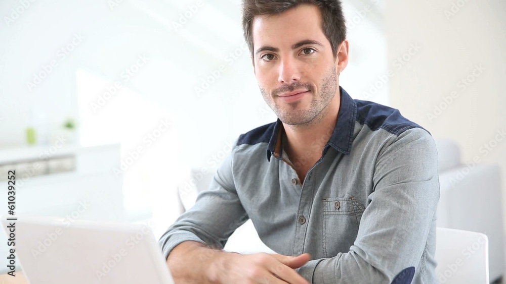 Man working from home with laptop Man working from home with laptop