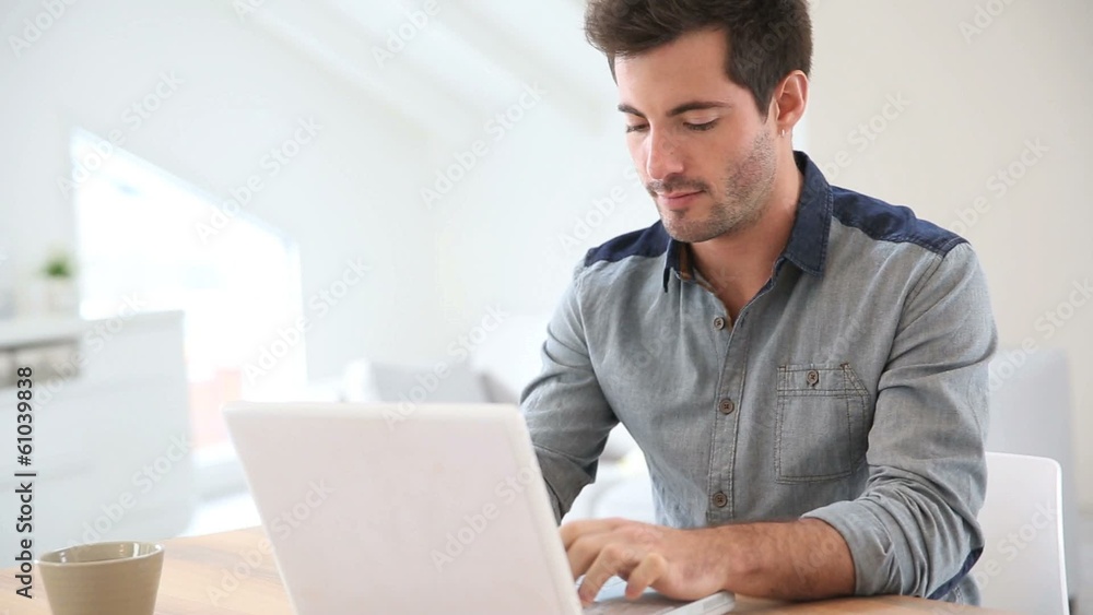 Man working from home with laptop Man working from home with laptop