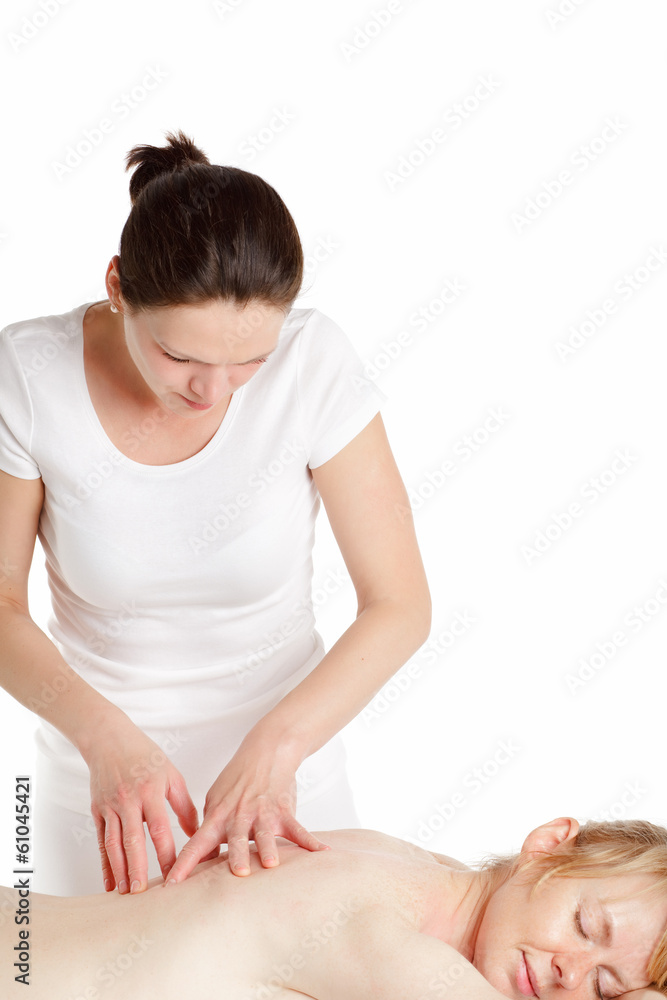 Massage therapist performing back massage.