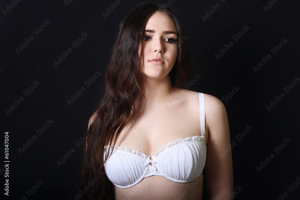 Fototapeta premium sexy and sad long hair brunette woman in white bra black back