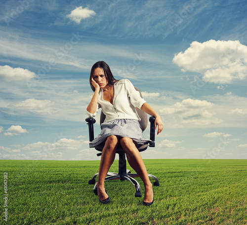 doleful businesswoman sitting