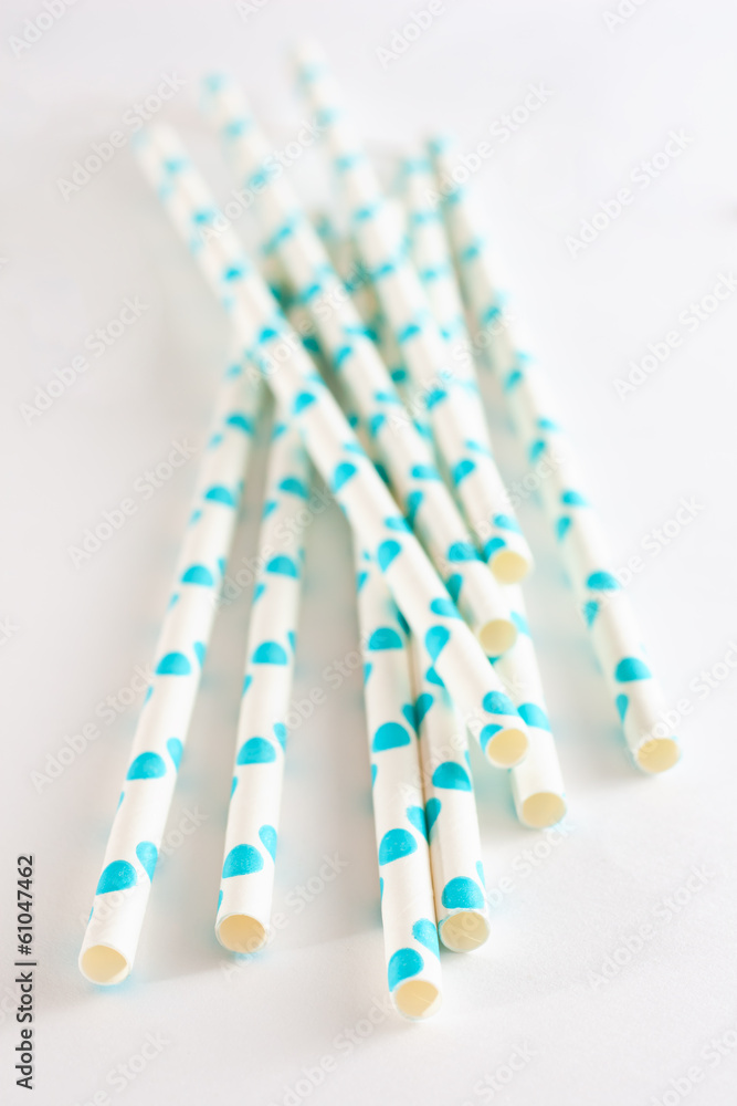 Paper drink straws on white background