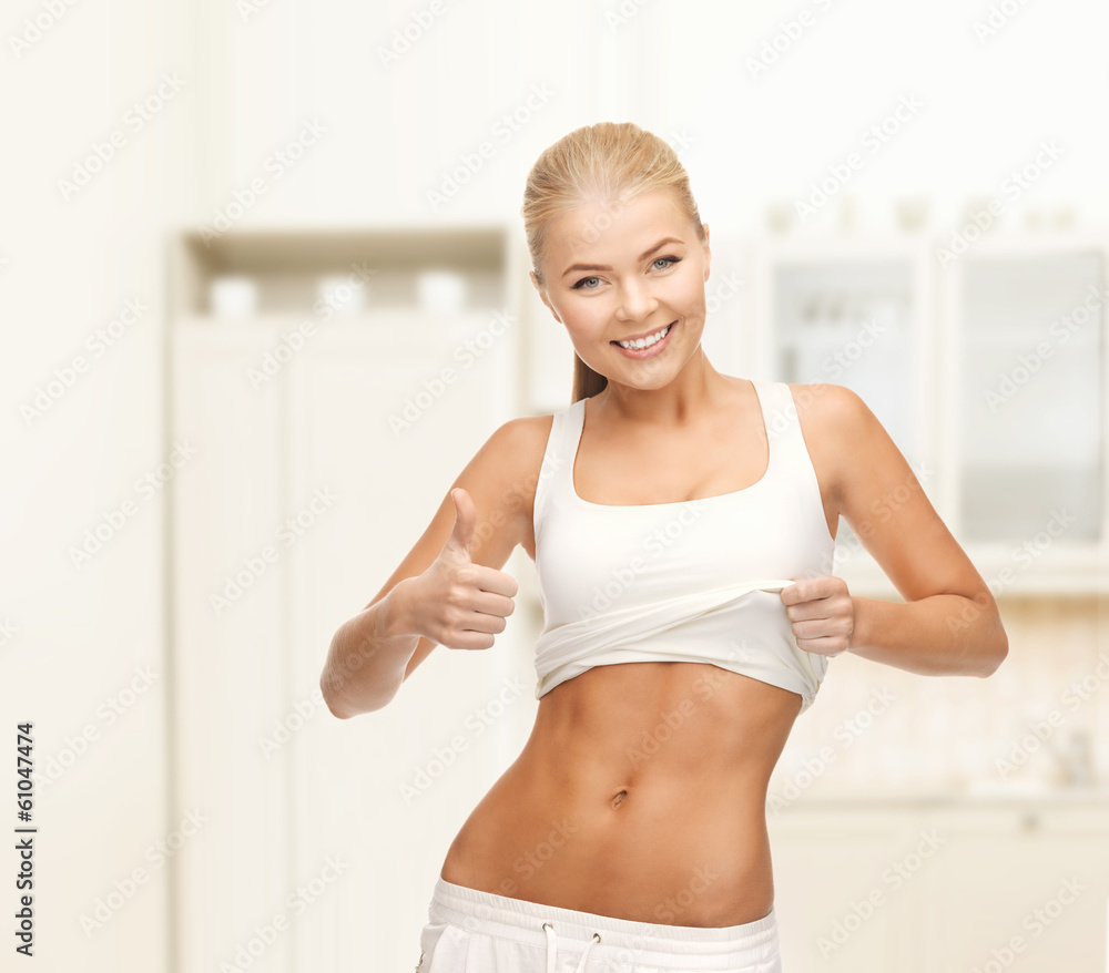 sporty woman showing thumbs up