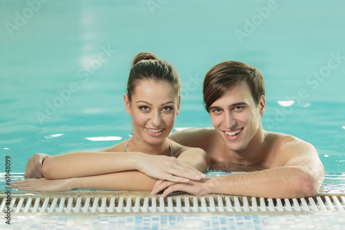 Young couple in the swimmin...