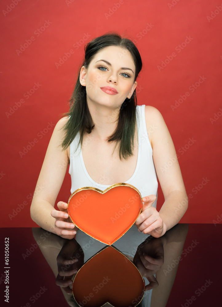 Beautiful young woman with a Valentines heart Beautiful young woman with a Valentines heart