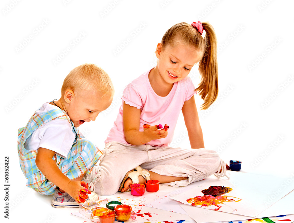 Child painting by finger paint.