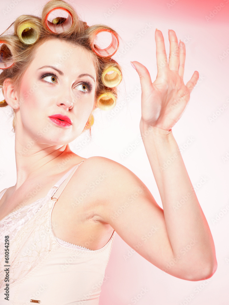 Fototapeta premium sexy girl in underwear curlers preparing to party