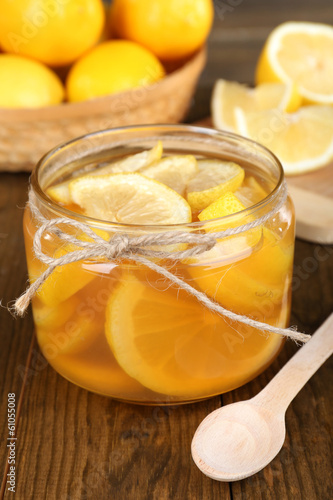 Tasty lemon jam on table close-up