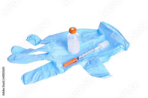 latex glove with a hyperdermic needle or syringe and an insulin bottle isolated on white photo