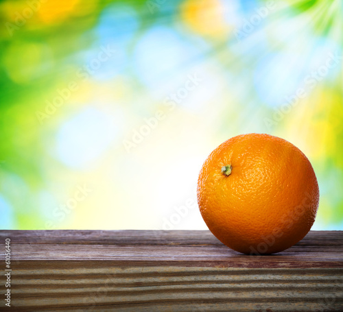 Orange on wooden table