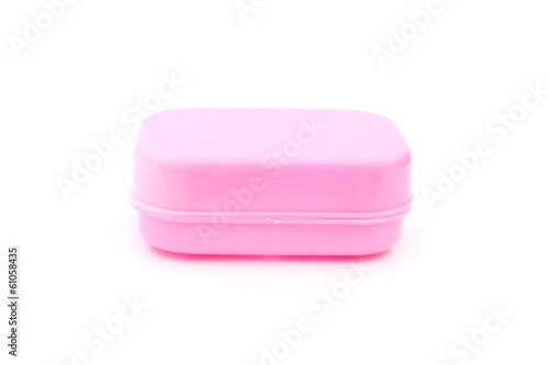 Fotografie pink plastic soap box on white background