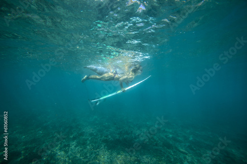 surfing a wave.underwater viewing. © trubavink