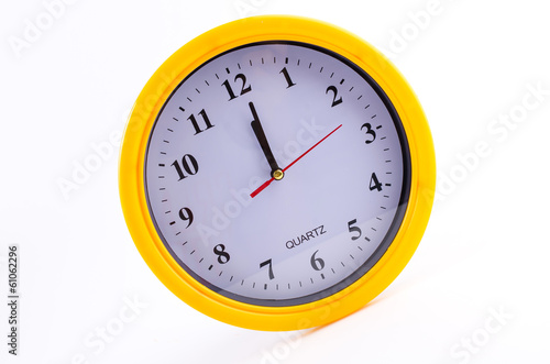 Yellow clock alarm isolated on white background