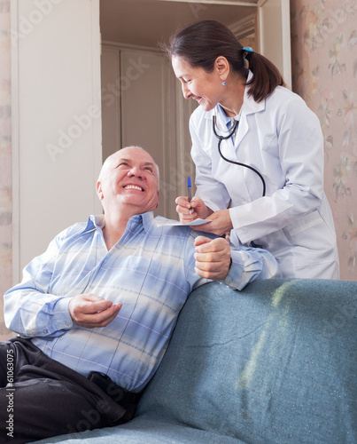 Happy senior man tells the doctor the symptoms