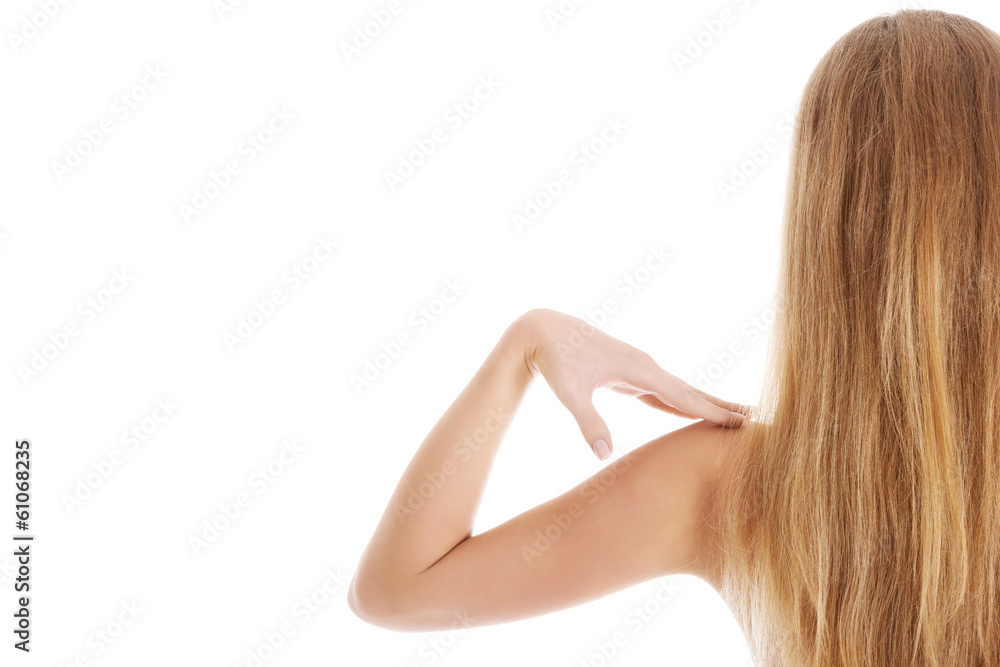 Beautiful topless woman touching her shoulder. Beautiful topless woman touching her shoulder.