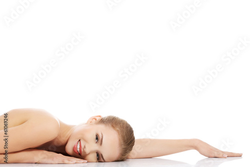 Beautiful caucasian naked woman lying down.