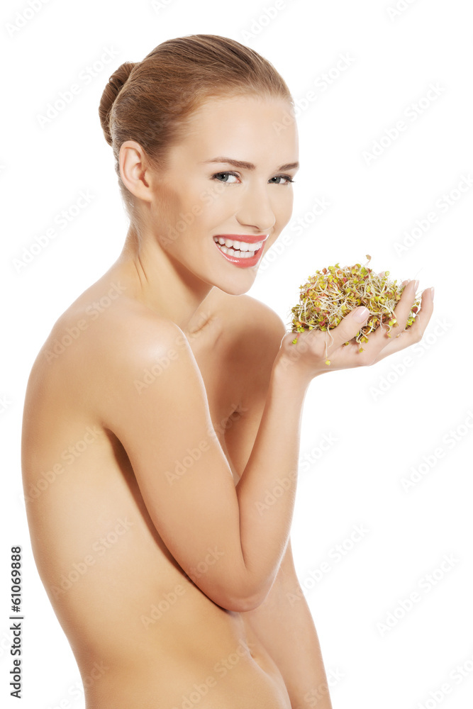 Beautiful caucasian topless woman with fresh green cress. Beautiful caucasian topless woman with fresh green cress.