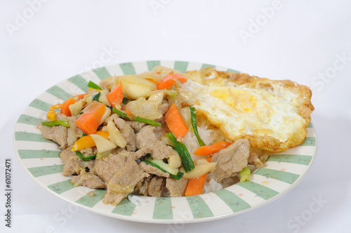 Cooked rice and mix vegetables with fried egg.