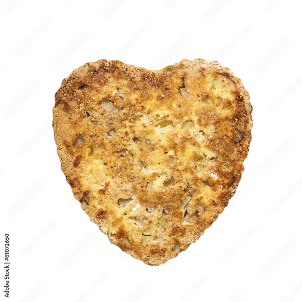 Sponge cake in heart shaped with apples and sesame , isolated Sponge cake in heart shaped with apples and sesame , isolated