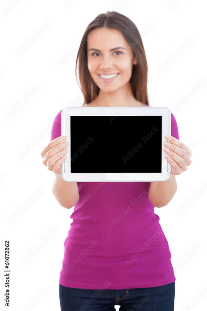 Copy space on her digital tablet. Copy space on her digital tablet.