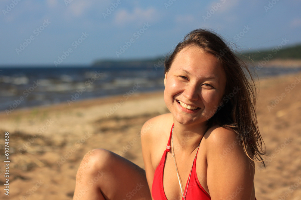 Portrait of smiling woman on the beach Portrait of smiling woman on the beach